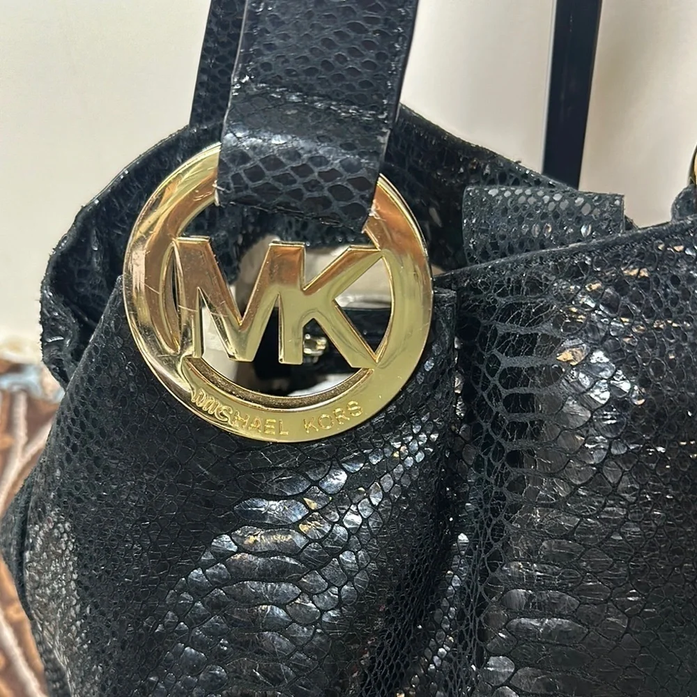 Michael Kors Black Hobo Bag with Gold Emblem